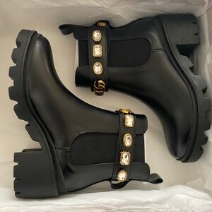 Gucci Elegant Black Ankle Boots with Gold Accents